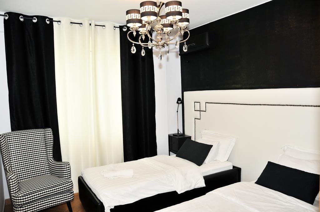 Tiranatop Suites Værelse billede